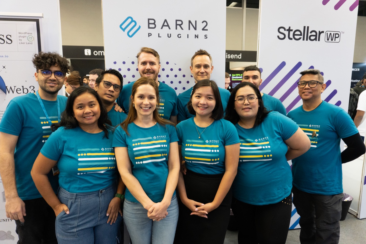 The Barn2 team at their booth at a WordCamp event